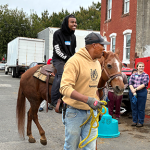 Professor Courtney Berne and students take a field-trip to the Fletcher Street Urban Riding Club.